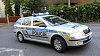 Policejn� eskorta p�iv�� ve st�edu ve�er Davida Ratha do v�znice.