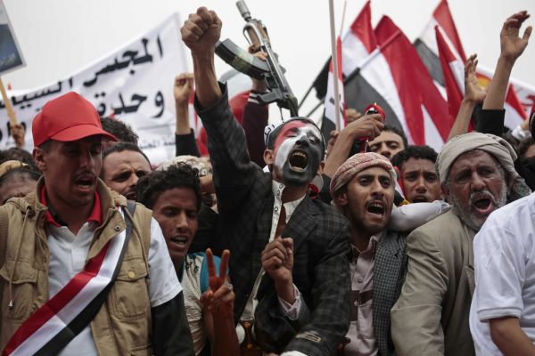Hundreds of thousands of Yemenis chant slogans during a march in support of a new combined governing council that the Shiite Houthi rebels and and their ally