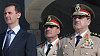 Bašár Asad a ministr obrany Dáud Radžha (vpravo)