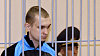 Dmitryj Konovalov (vlevo) a Vladislav Kovalev (vpravo) před soudem Soudní stání s atentátníky z minského metra (15. září 2011)