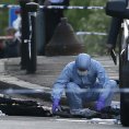 Odborníci zkoumají místo činu ve Woolwich.