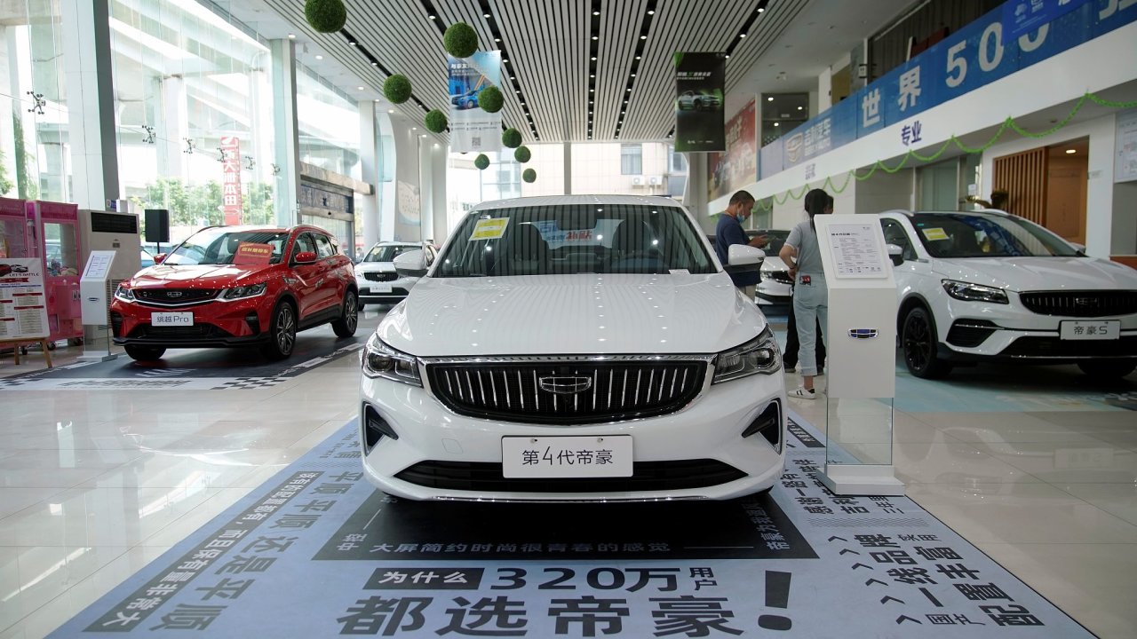 Geely vehicles are displayed at a car dealership in Shanghai, China