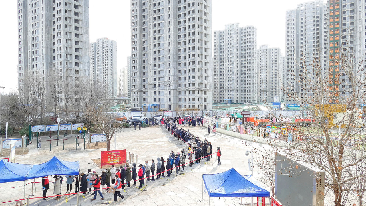People line up for nucleic acid testing during a citywide mass testing for the coronavirus disease (COVID-19) after local cases of the Omicron variant were detected in Tianjin