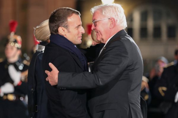 French President Emmanuel Macron, left, welcomes German President Frank-Walter Steinmeie