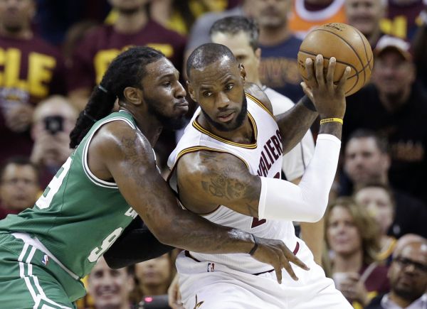 Cleveland Cavaliers' LeBron James (23) backs down Boston Celtics' Jae Crowder (99) during the first half of Game 3 of the NBA basketball Eastern Conference finals