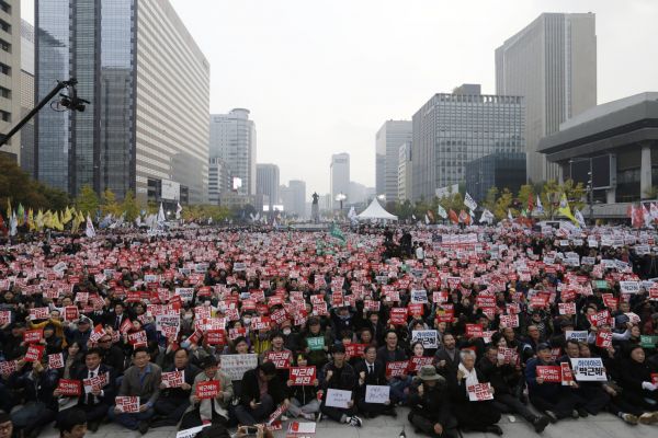 South Korean protesters stage a rally calling for South Korean President Park Geun-hye to step down in downtown Seoul