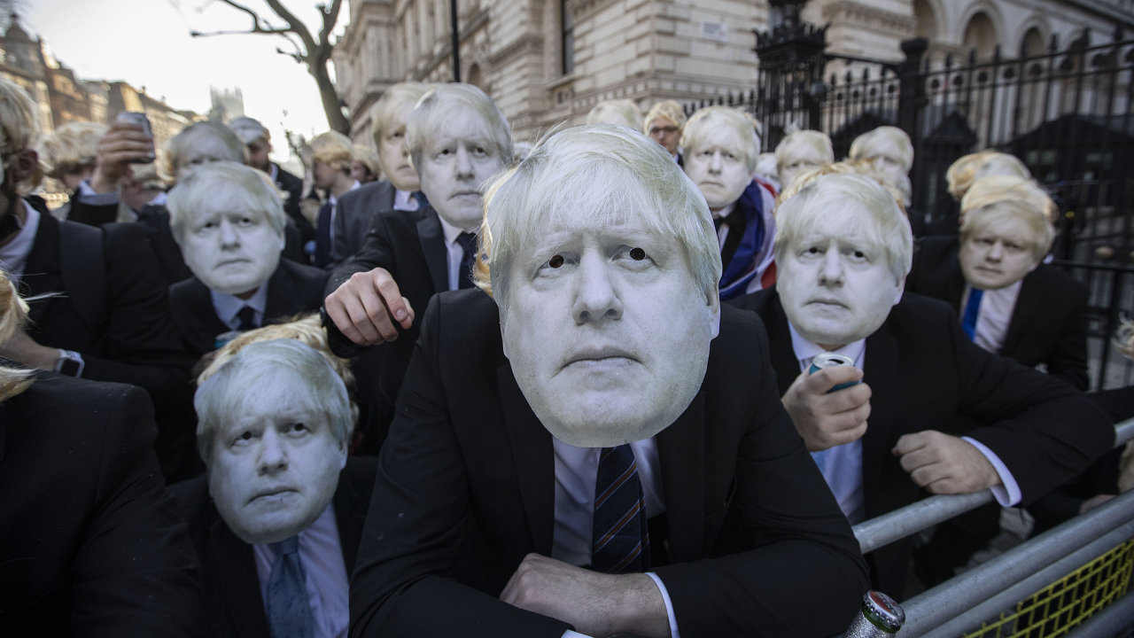 Flash-mob of partygate anti Boris Johnson protesters wearing floppy blond wigs and Boris Johnson masks and suits gathered outside Downing Street drinking beer and wine while dancing to techno music