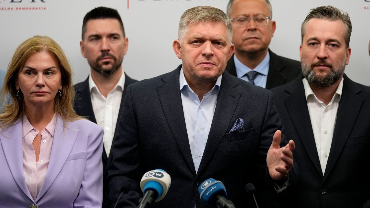 Chairman of Smer-Social Democracy party Robert Fico, center, adresses the results of an early parliamentary election during a press conference in Bratislava