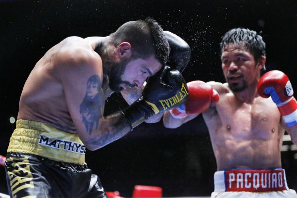 Manny Pacquiao of the Philippines fights Lucas Matthysse of Argentina during their WBA World welterweight title bout  in Kuala Lumpur