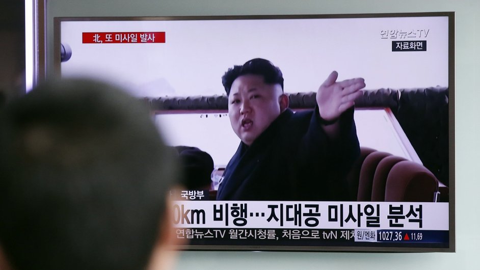 A man watches a TV news program showing a file footage of North Korean leader Kim Jong Un at Seoul Railway Station in Seoul