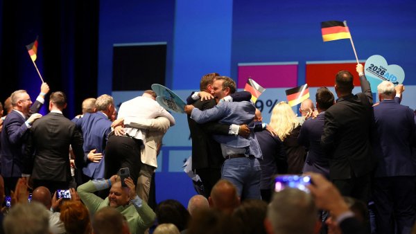 Supporters of far-right Alternative for Germany (AfD) celebrate, after polls...