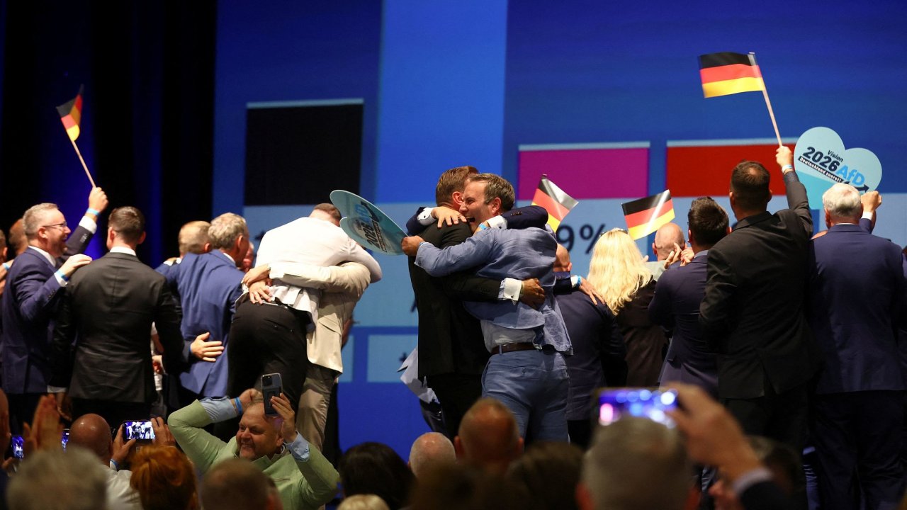 Supporters of far-right Alternative for Germany (AfD) celebrate, after polls...