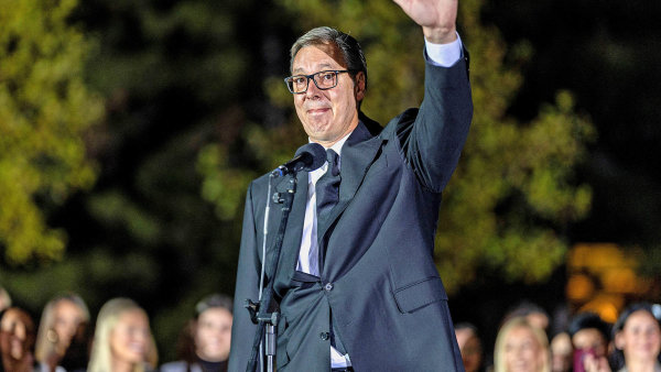 Serbian President Aleksandar Vucic waves to citizens outside the Presidency...