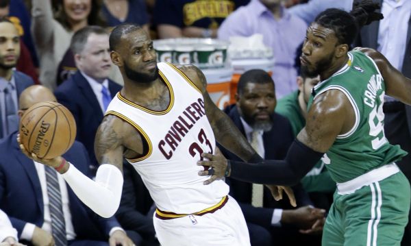 Cleveland Cavaliers' LeBron James (23) looks to pass around Boston Celtics' Jae Crowder (99) during the first half of Game 4 of the NBA basketball Eastern Conference finals