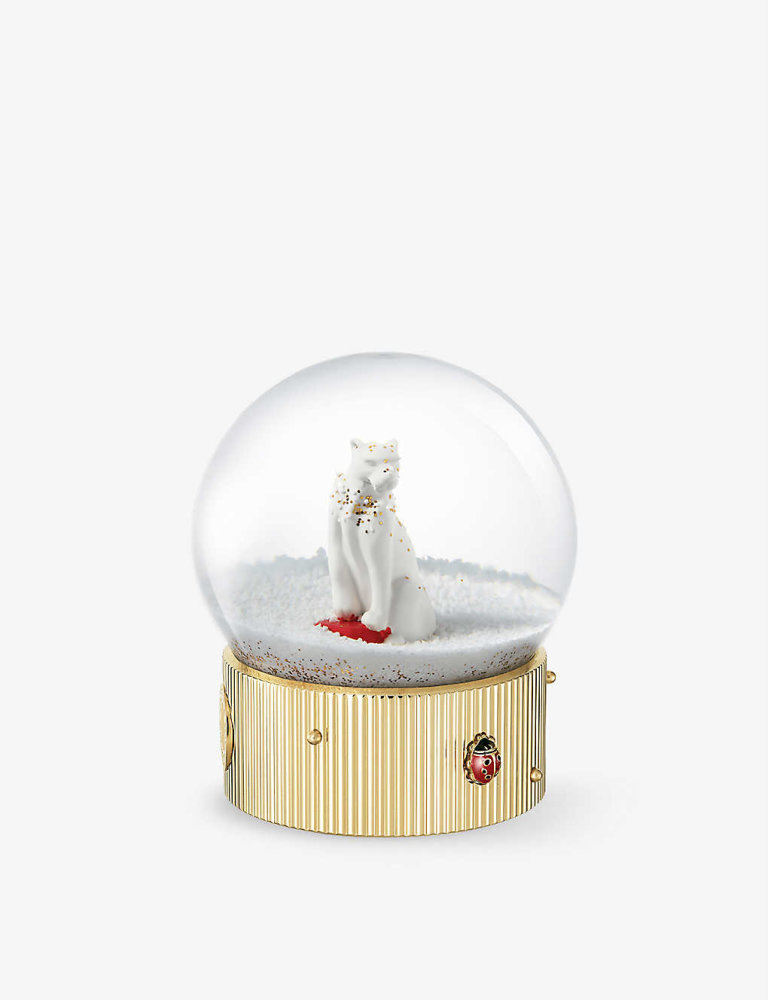 Cartier sněžítko Sněžítko, zlatý lak ze skleněné pryskyřice, výška 11 cm, průměr 8 cm, cena 1300 liber, prodává: Selfridges.com