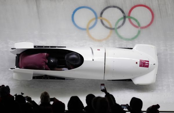 Driver Nadezhda Sergeeva and Anastasia Kocherzhova of the Olympic Athletes of Russia take a curve in their third heat during the women's two-man bobsled final at the 2018 Winter Olympics in Pyeongchan