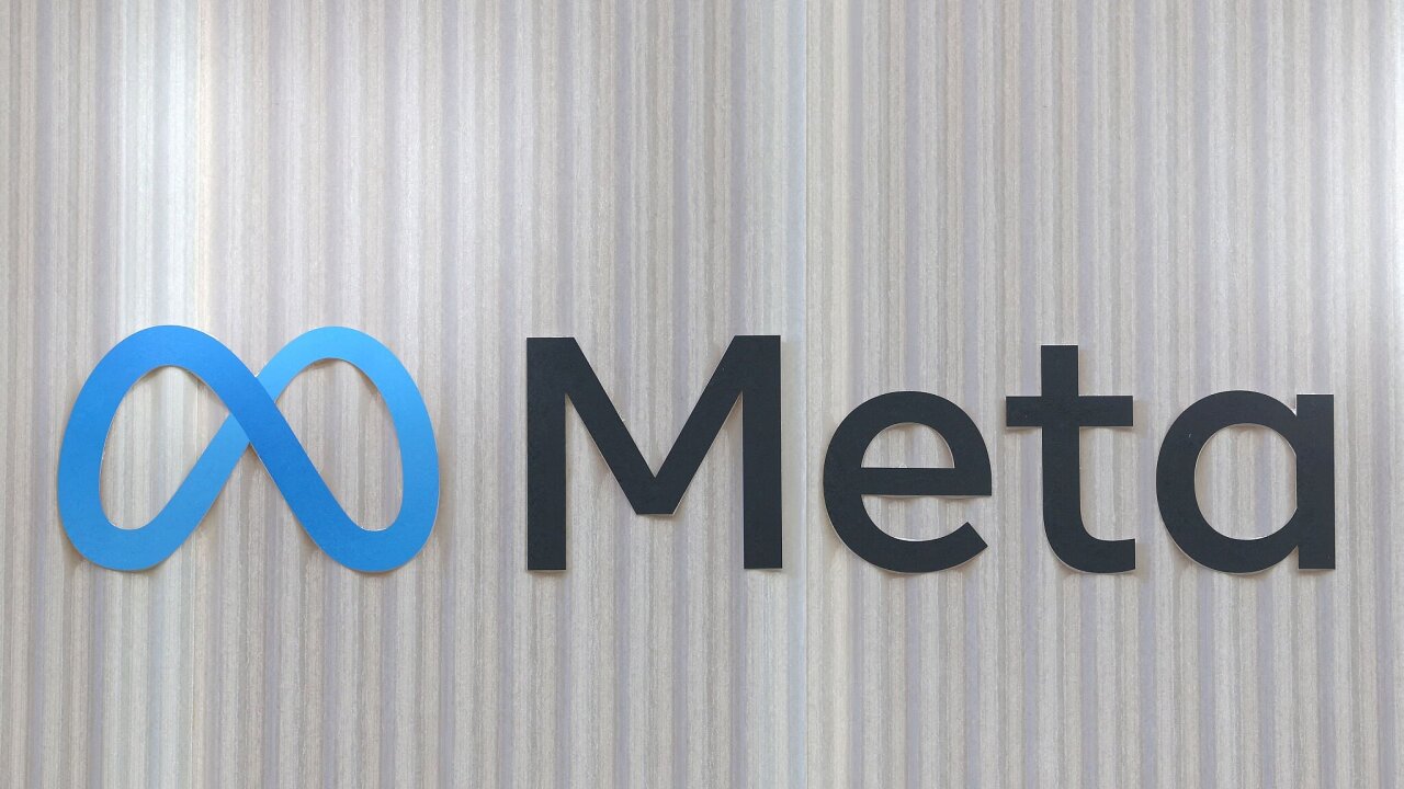 FILE PHOTO: The logo of Meta is seen at the entrance of the company’s...
