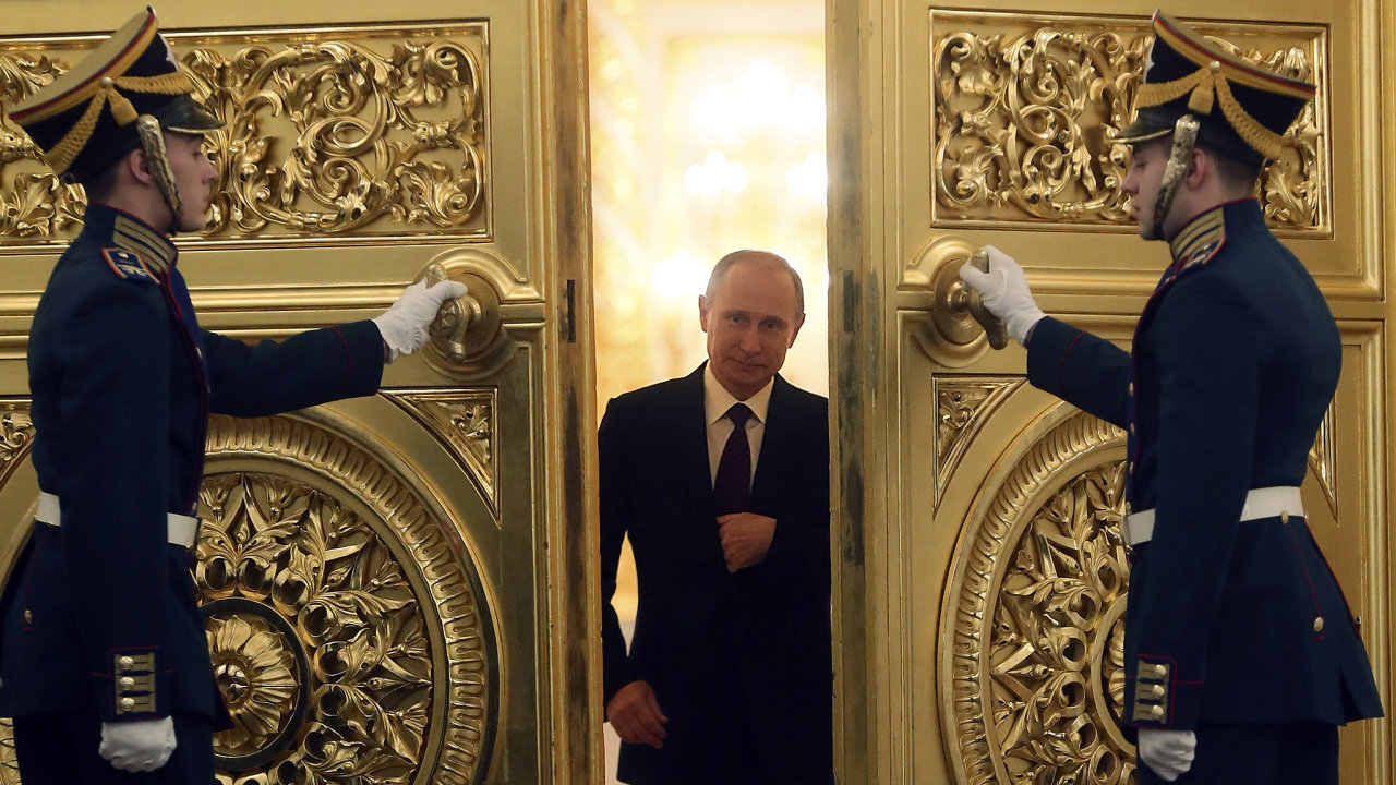 Russia President Vladimir Putin walks in before delivering his annual state of the nation address at the Kremlin in Moscow