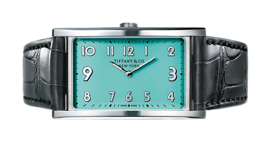Drobn svou velikost, ale nepehldnuteln dky barv aoriginlnmu otoenmu selnku jsou nov unisexov hodinky East West Mini sedm pskem. | Cena 100000 K, prodv TIFFANY & Co.