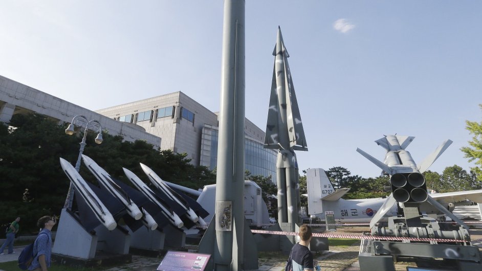 Visitors watch models of North Korea's Scud-B missile