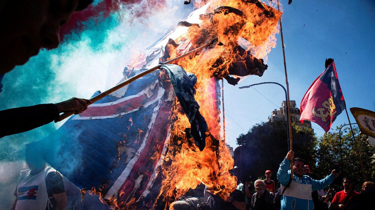 Demonstrators burn a British flag during a protest near the British Embassy on the 40th anniversary of the 1982 Falklands Malvinas War, in Buenos Aires, Argentina April 2, 2022.