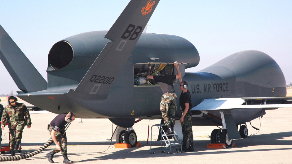 Avionics specialists with the 12th Aircraft Maintenance Unit prepare the Global Hawk for a runway taxi test Oct. 13