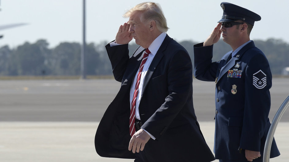 President Donald Trump salutes as he steps off of Air Force One at MacDill Air Force Base in Tampa