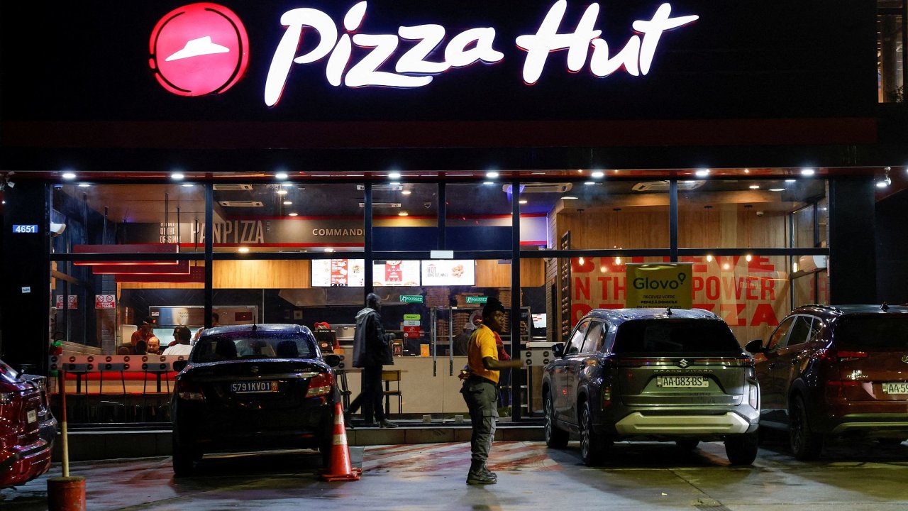 FILE PHOTO: A security guard stands in front Pizza hut fast food restaurant...