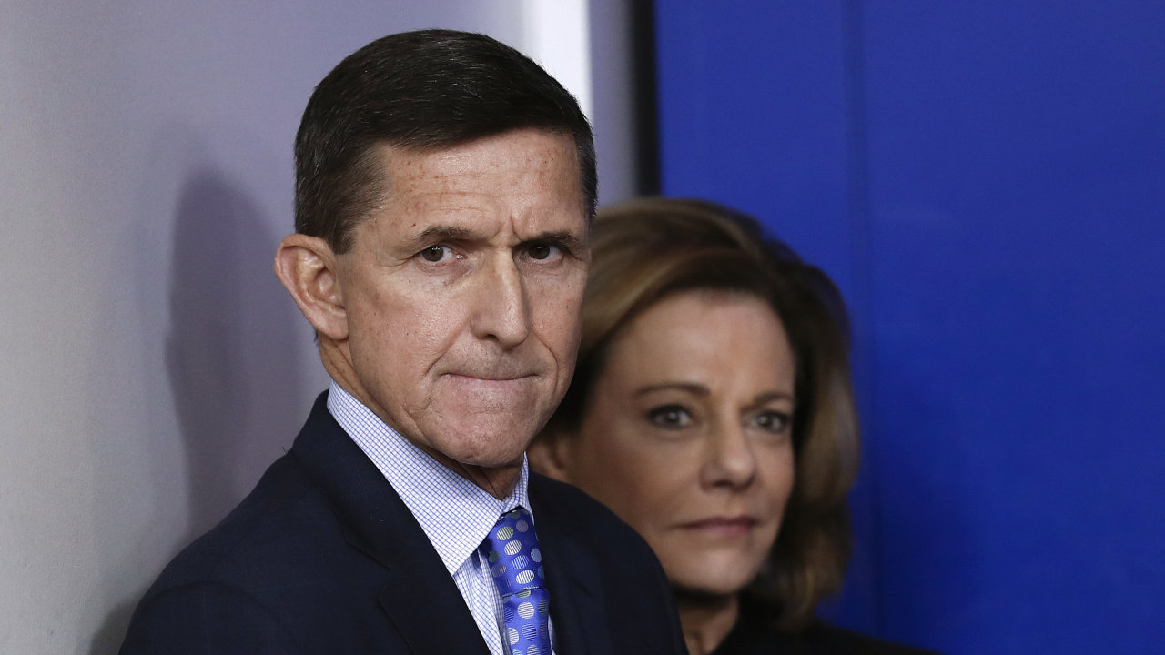 National Security Adviser Michael Flynn stands with K.T. McFarland